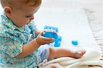 Baby boy playing with building blocks