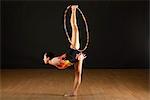 Gymnast performing standing splits with hood