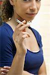 Young woman smoking cigarette