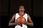 Basketball player preparing to shoot basketball, portrait