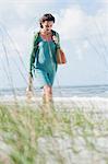 Teenage girl walking on beach