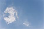 Wispy clouds in blue sky