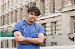 Portrait of an Indian male doctor standing with arms crossed