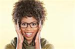 Portrait of a happy African American wearing glasses over colored background