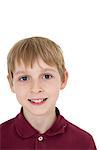 Close-up portrait of happy blond boy over white background