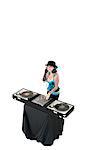 Portrait of young DJ with sound mixing equipment wearing hat over white background