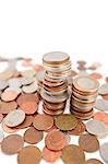 Close-up of heap of coins over white background