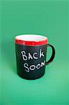 Coffee mug with text over colored background