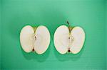 Sliced green apple over green background