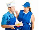 Teen girl working in fast food gets pushed around by her boss.  Isolated on white.