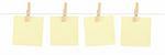 A set of four blank yellow sticky notes held on a string with clothespins isolated on white.