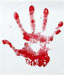 A red hand print on textured paper towlel.