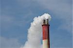 smoky chimney on background of blue sky