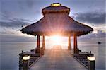 Vivid sunrise over the jetty in the Indian ocean, Maldives.