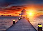 Vivid sunset over the jetty in the Indian ocean, Maldives. HDR