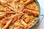 traditional spanish paella with prawn on big pan