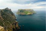 Tasman Island standing of the steep cliffs of Cape Pillar, Tasmanian coast, Australia