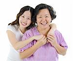 Happy Asian senior mother and adult daughter over white background
