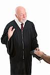 Judge swearing in a witness on the Holy Bible.  Isolated on white.