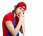 Serious teenage girl in her work uniform, leaning on a mop or broom handle.  Isolated on white.