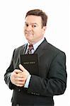 Businessman holding the Bible.  Isolated on white.