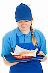 Teenage fast food worker disgusted by the burger and fries she's serving.  Isolated on white.