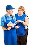 Teenage fast food worker getting instructions from her middle-aged boss.  Isolated on white.