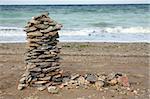 Balanced tower of stones on the beach