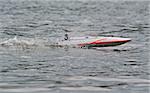 automated mini boat at the racers in a river