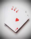 Ace, two and three of hearts