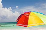 Bright beach umbrella on Playa Del Carmen, Quintana Roo, Mexico