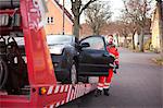 Man preparing car to get towed