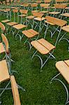 Rows on chairs on lawn