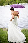 Bride walking on lakeside