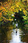 Man rowing paddle board in water