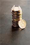 Stack of coins with figurine