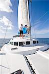 Man standing on sailing boat