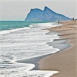 Tourist walking toward Gibraltar, Alcaidesa beach, near Sotogrande, Andalucia, Spain, Europe