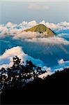 Mountain summit rising high above the clouds taken from Mount Rinjani volcano, Lombok, Indonesia, Southeast Asia, Asia