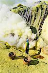 Sulphur worker mining sulphur at the bottom of the crater, Kawah Ijen, Java, Indonesia, Southeast Asia, Asia