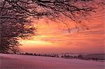 Spectacular dawn sky above snow covered countryside, Exmoor, Somerset, England, United Kingdom, Europe