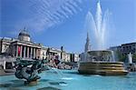 Tritons and dolphin fountain with the Olympic digital countdown clock and the National Gallery, Trafalgar Square, London, England, United Kingdom, Europe