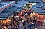 View over market square at dusk, Place Jemaa El Fna, Marrakesh, Morocco, North Africa, Africa