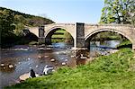 People eating ice cream at Barden Bridge over the River Wharfe, Wharfedale, Yorkshire Dales, Yorkshire, England, United Kingdom, Europe