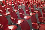 Empty red chairs in room