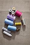Thread, sewing needle and thimble