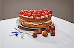 Layer cake with cream and strawberries
