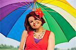 Woman holding colorful umbrella
