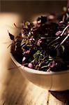 Close up of bowl of purple basil leaves