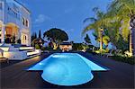 Illuminated pool outside villa